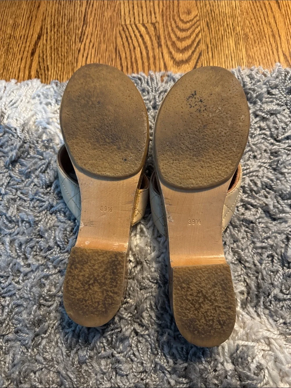 CHANEL Cream Quilted Leather Slide Mules with Logo Accent